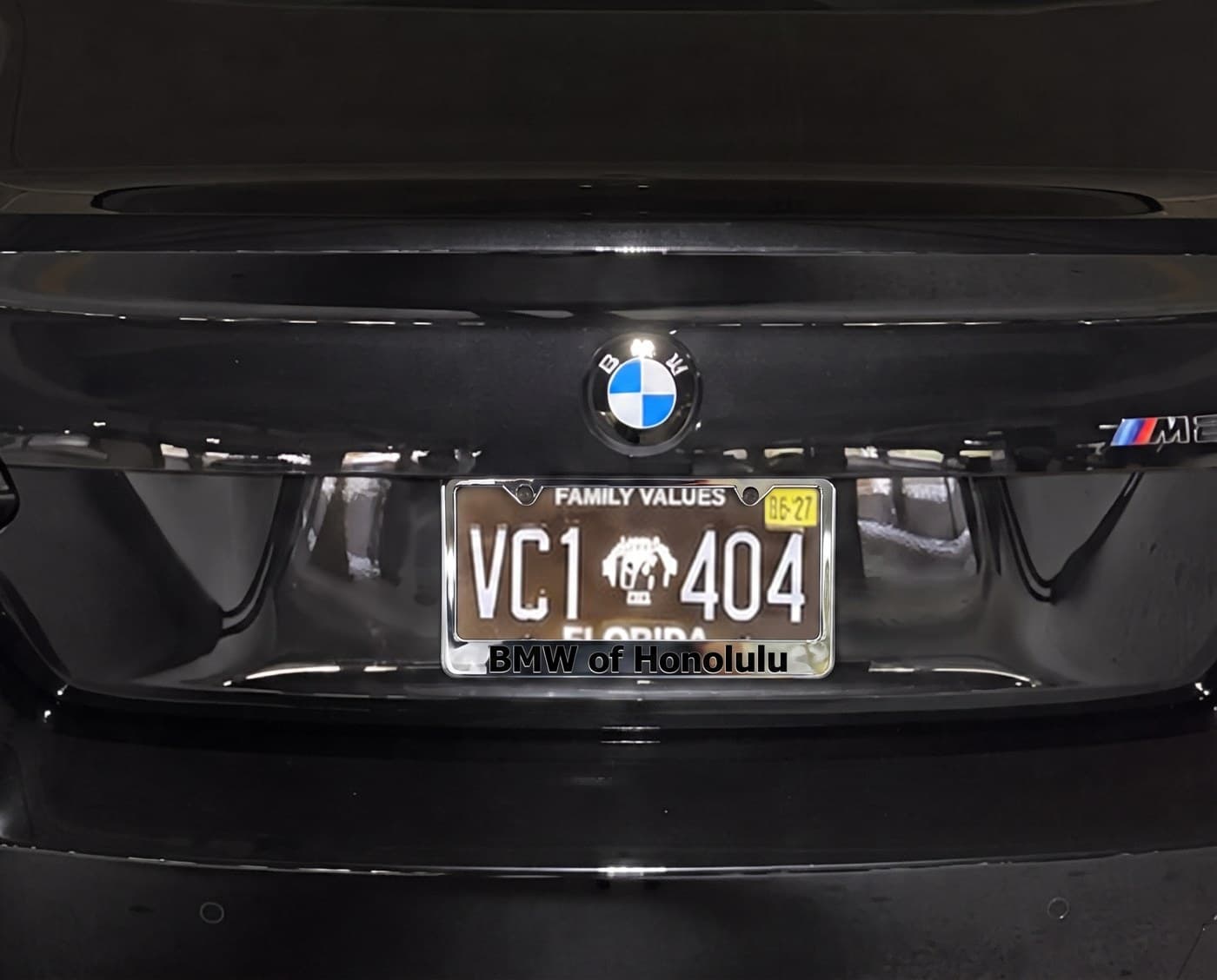 BMW M2 license plate close-up — Dealership frame